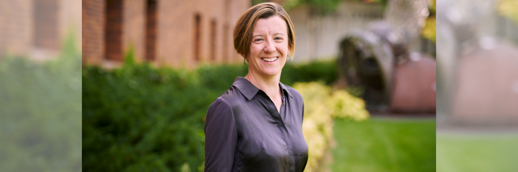 Catherine O'Rourke smiling at the camera wearing a dark coloured shirt