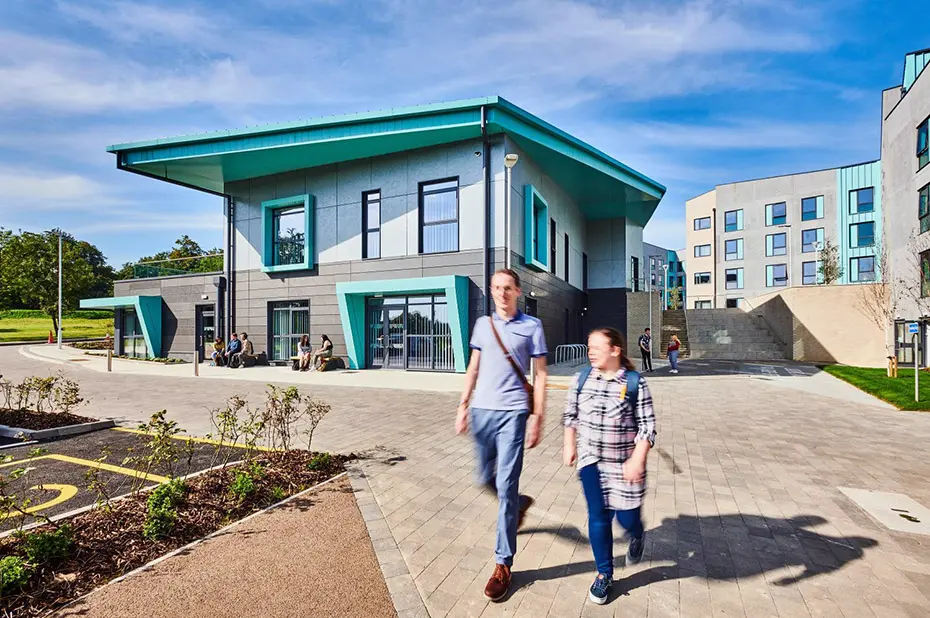Two of students walking outside of South College