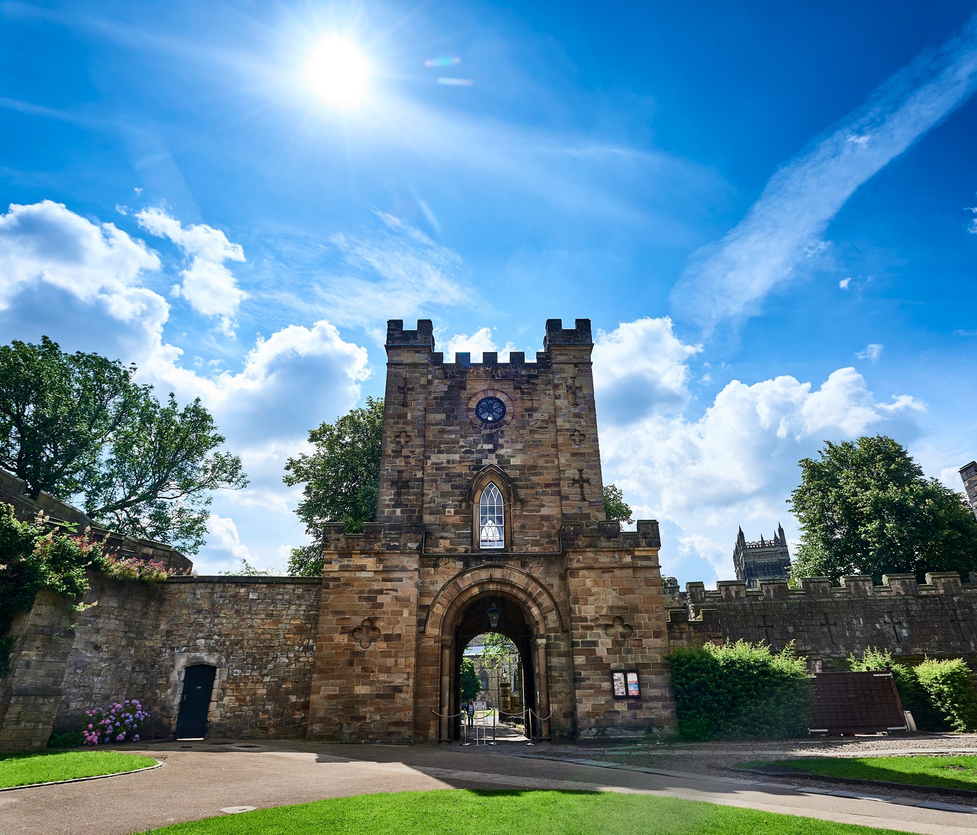 A coloured photograph of the Gatehouse from the Courtyard. The Gatehouse is at the centre of the picture, in the background are trees and Durham Cathedral.
