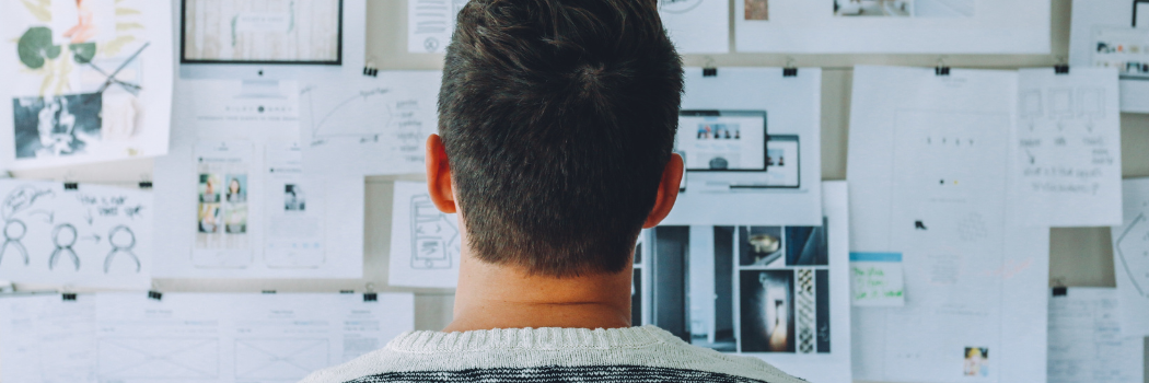 Male Entrepreneur Looking at His Vision Board