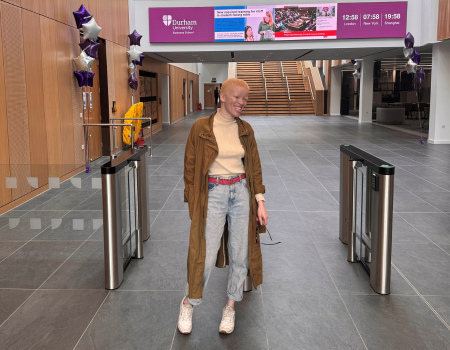 Photograph of alumna Ofentse visiting Waterside building