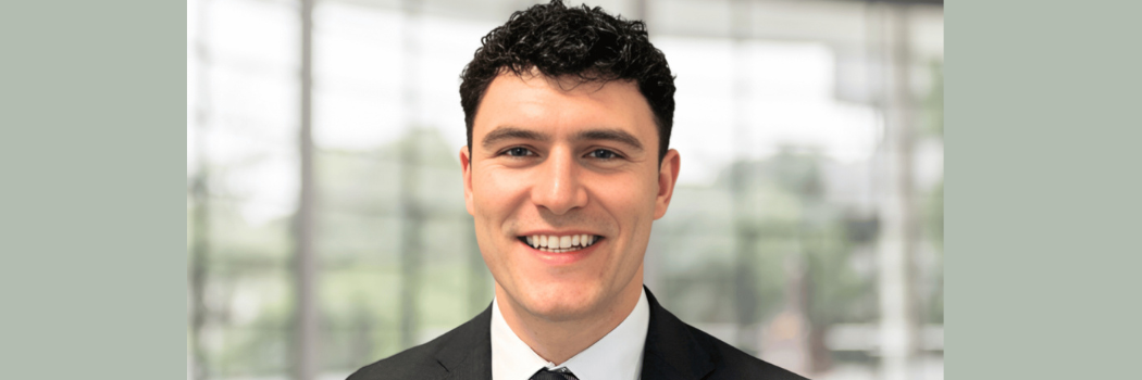 headshot of male student smiling to camera