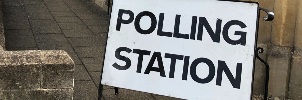 Polling station sign outside of building