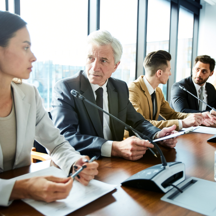 A group of business people around a table