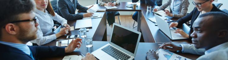 A group of business people around a table