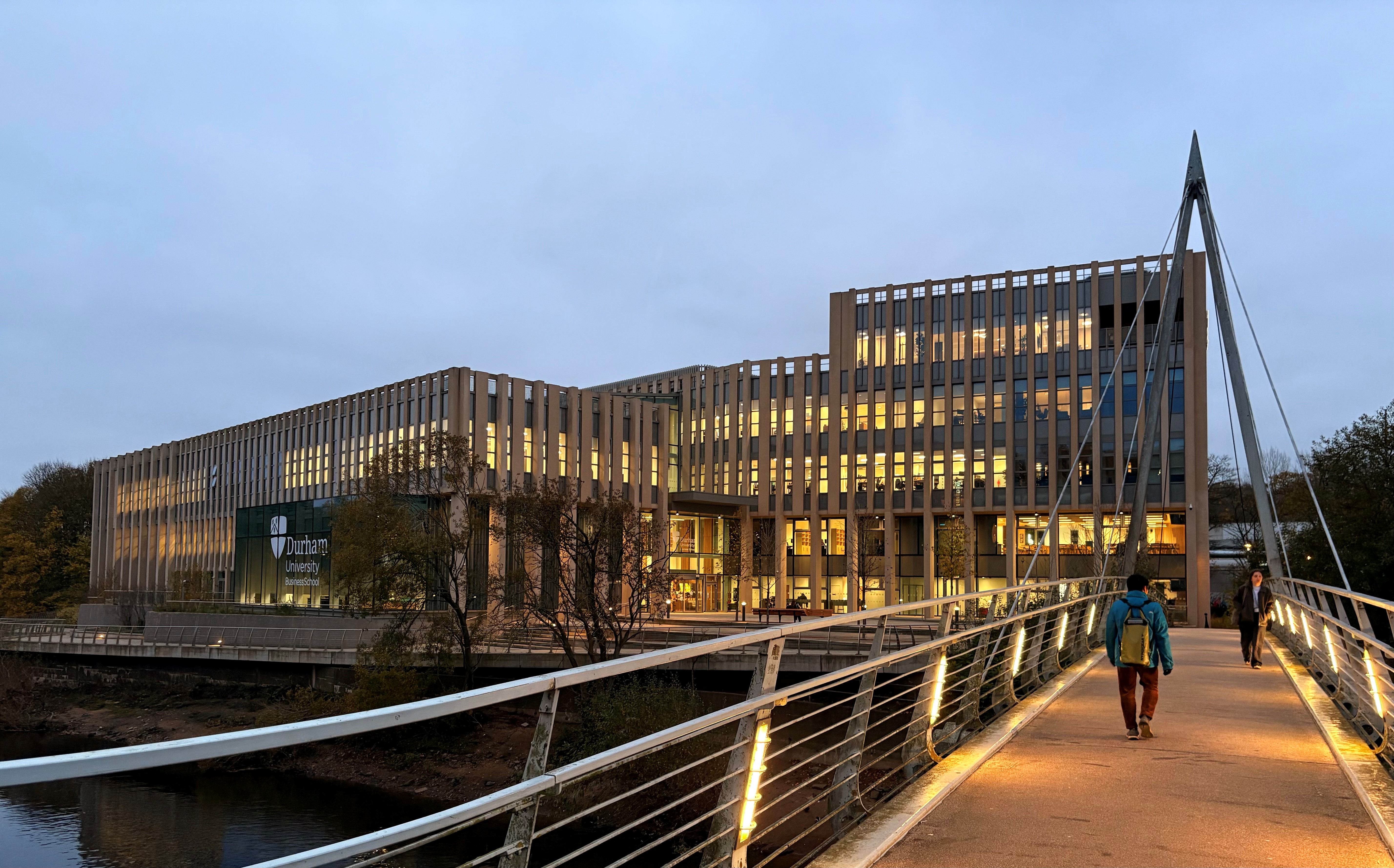 A building lit up at dusk