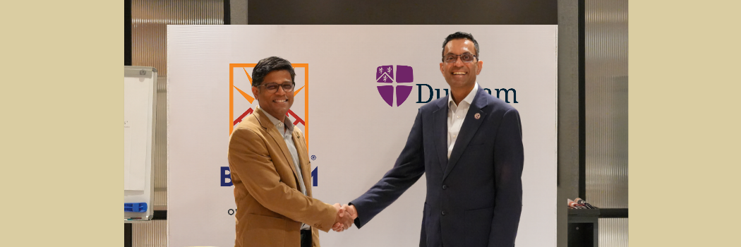 Kieran Fernandes shaking hands with BiTSOM leader in MOU signing