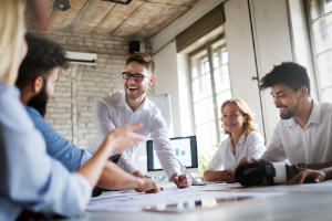 Business people sitting round a table at a meeting