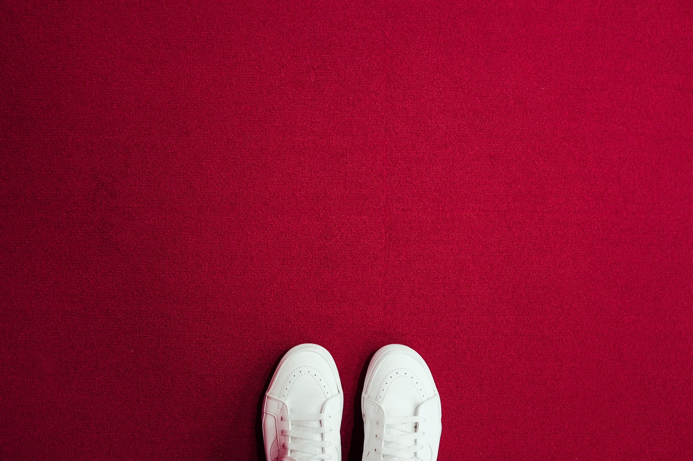 White shoes on red carpet