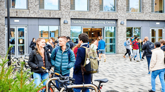 A group of students outside the teaching and learning centre