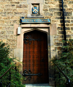 Hatfield College door, crest and latin motto