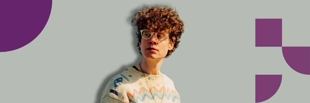 Headshot Michael Pedersen with glasses and curly hair