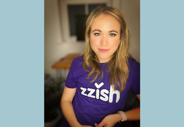 Daisy Hill wearing a branded Zzish tshirt