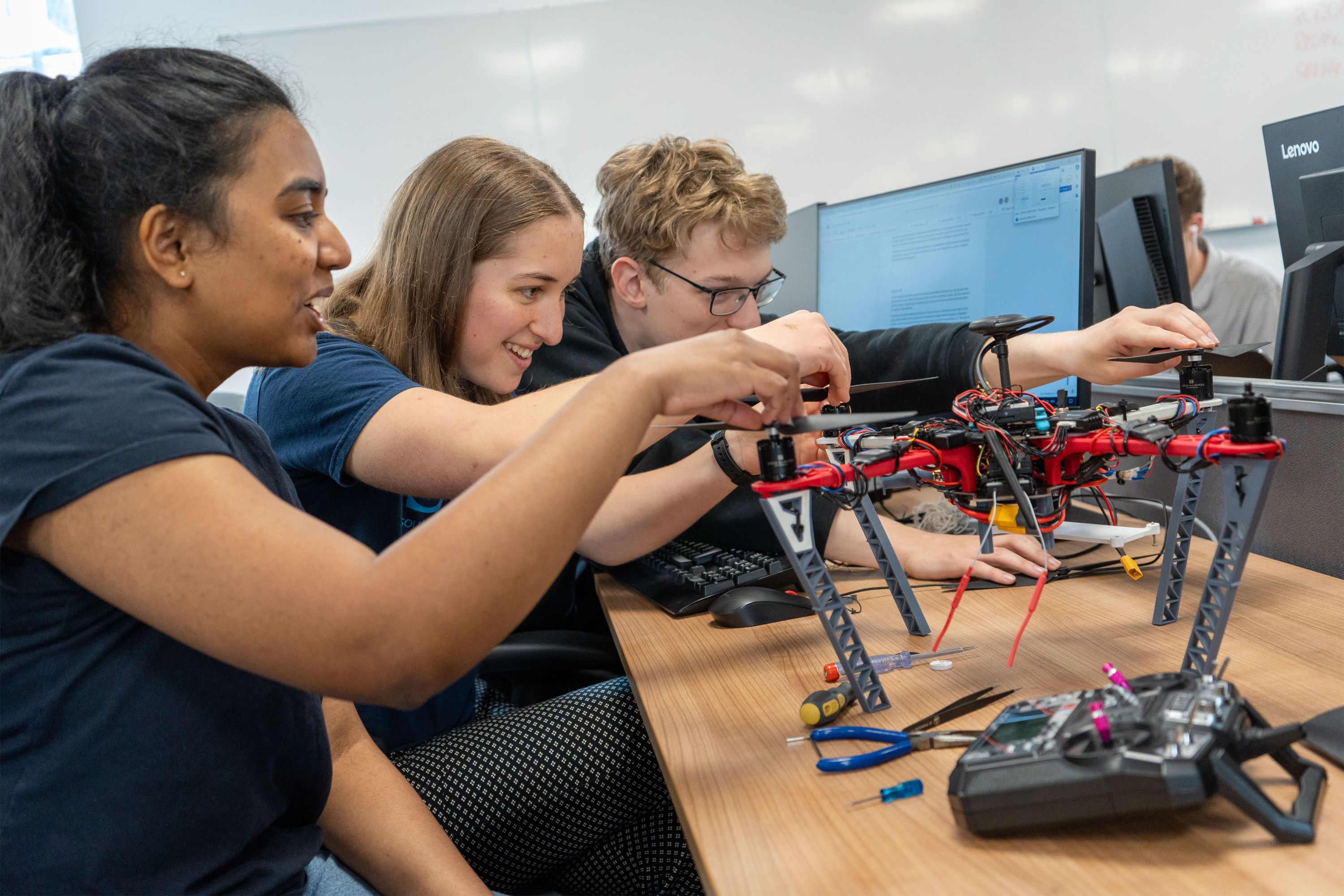 Engineering students designing and building a drone