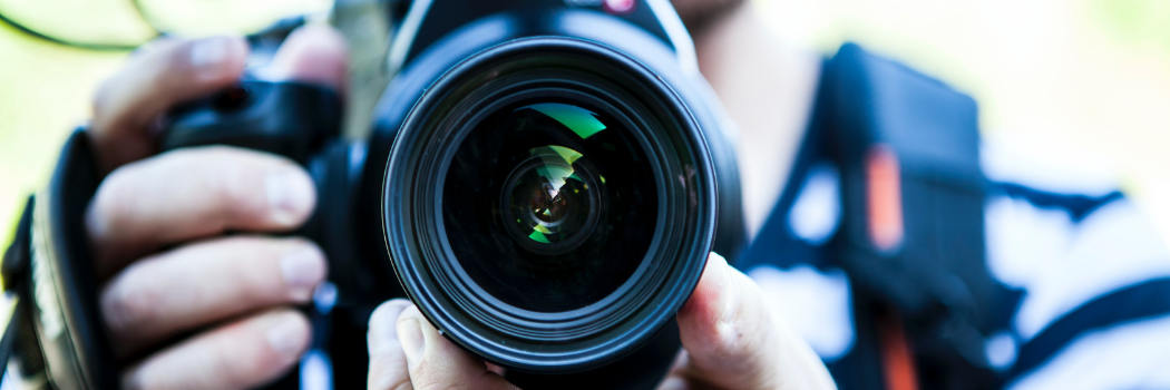 Person Holding Canon Dslr Camera Close-up Photo