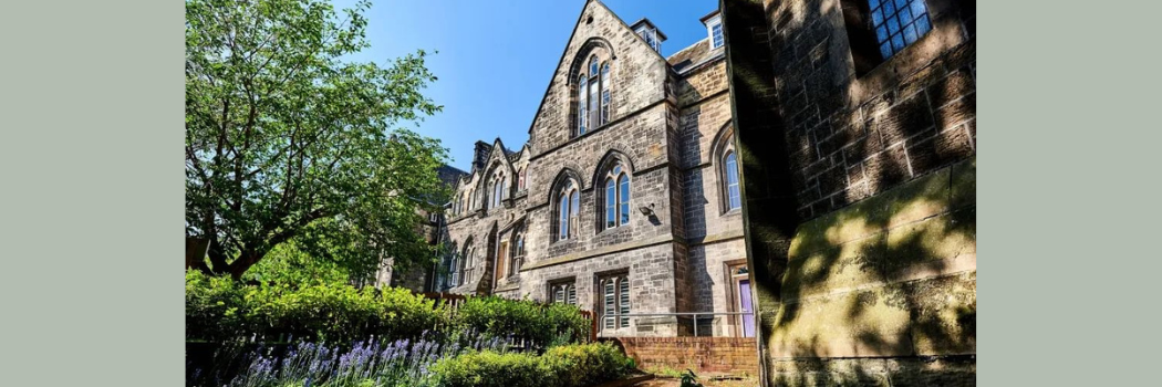External shot of the College of St Hild and St Bede with blue sky in the background