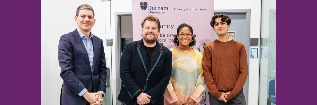 James Corden poses for a photo with three Durham community members