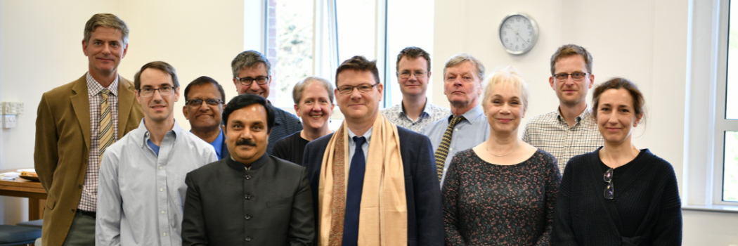 A group of people looking at the camera and smiling.