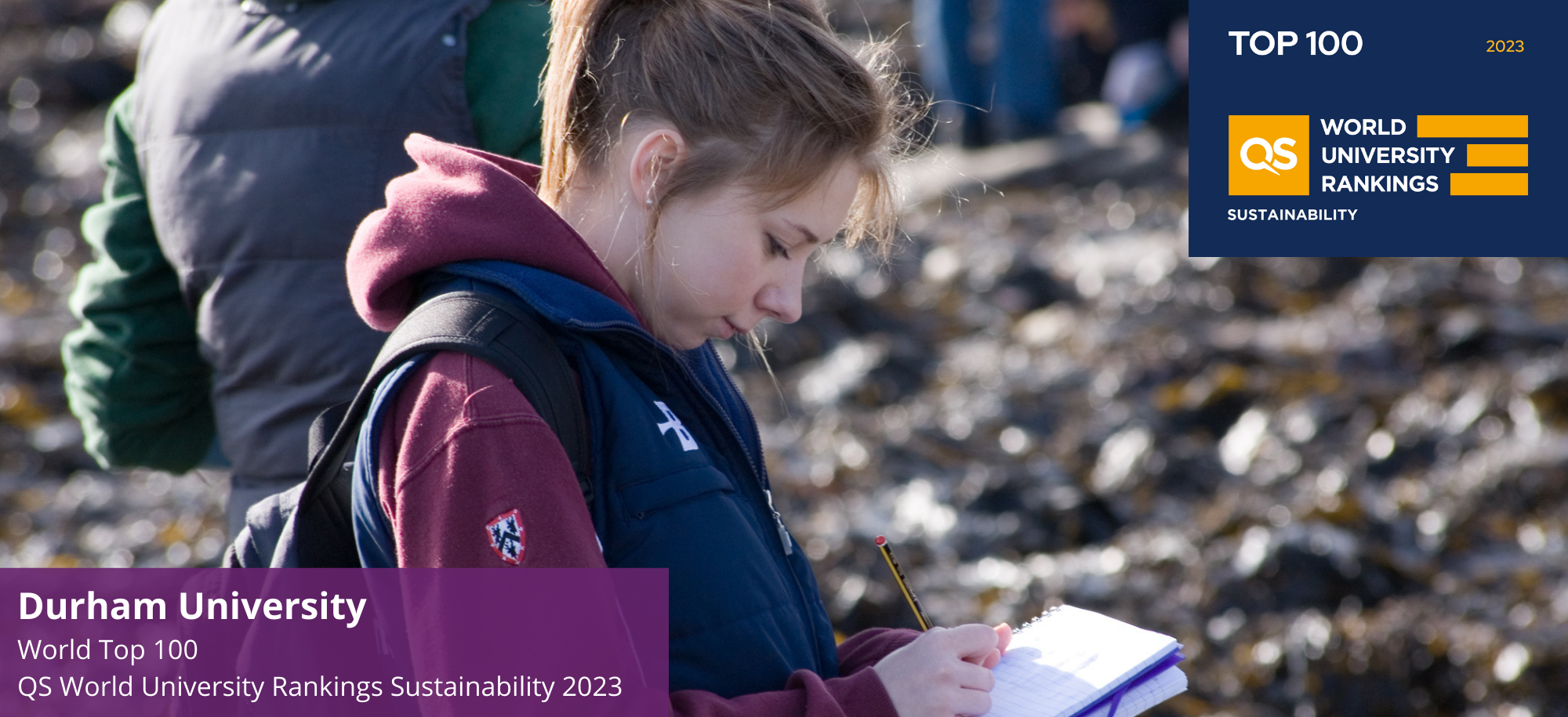 Student writing notes on a pad of paper