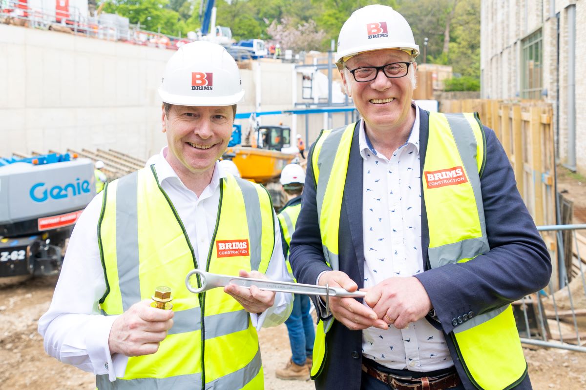 Jeremy Cook and Simon Forrest at Rushford Court Glden Bolt ceremony, holding the golden bolt and spanner