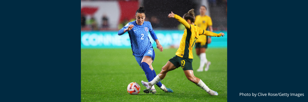 England player, Lucy Bronze runs with the ball whilst under pressure from Katrina Gorry of Australia during a friendly.