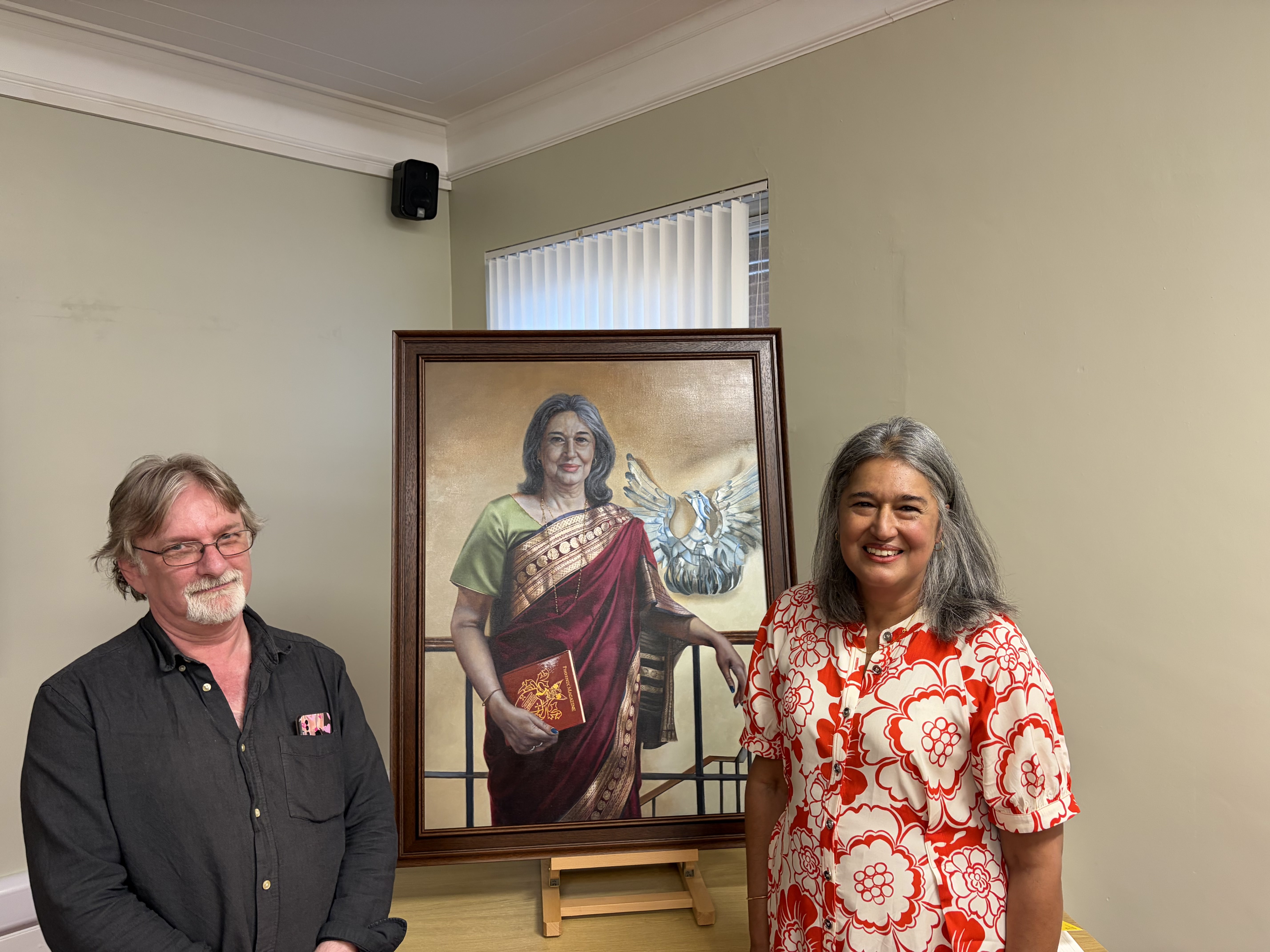 Principal Sonia Virdee pictured with her portrait