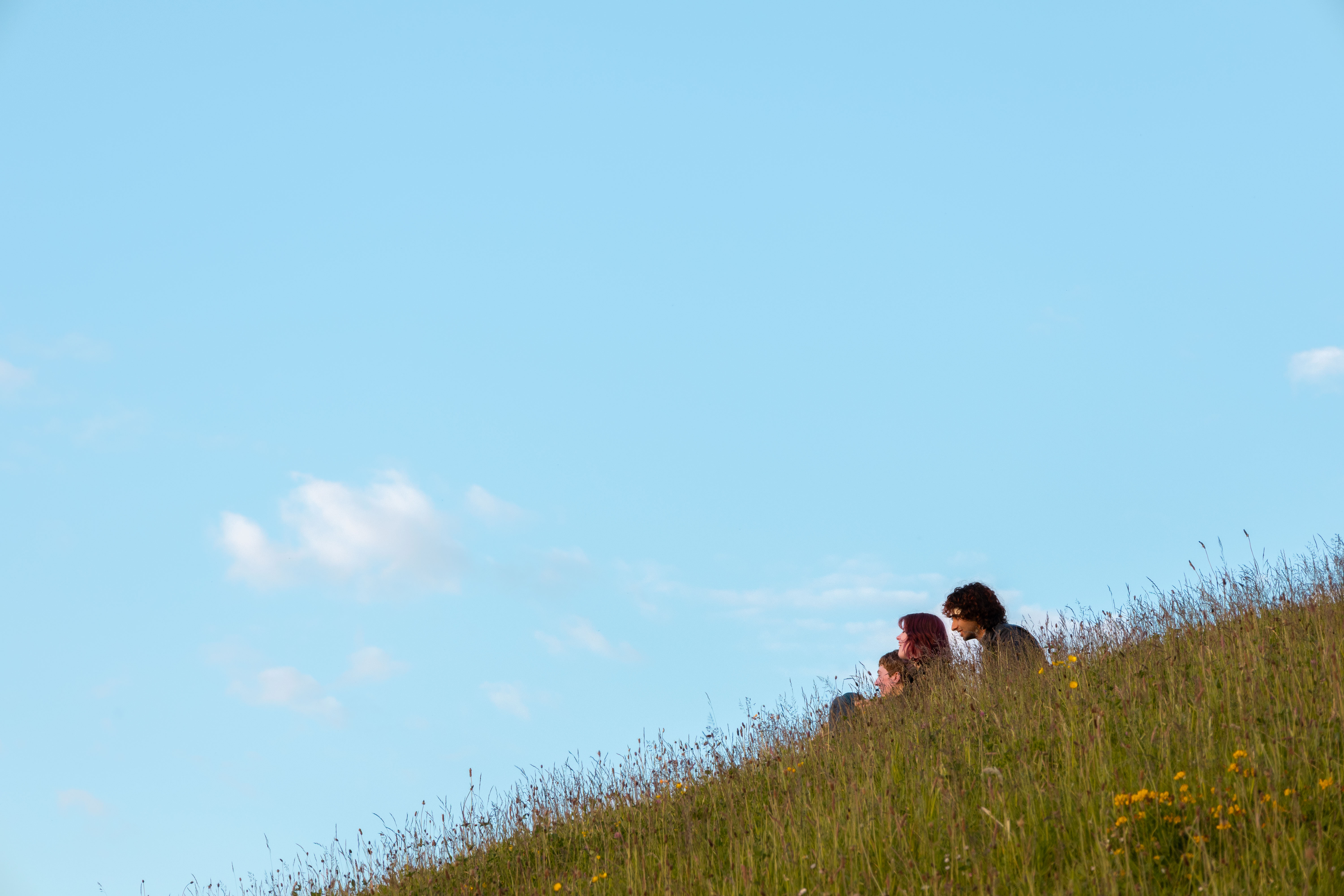 Photo of students sat on the mound