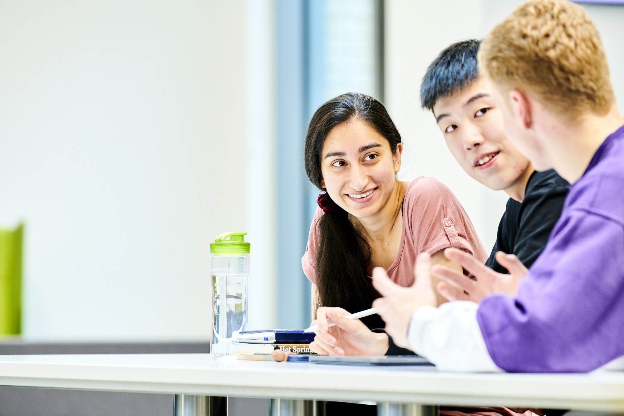 Three students working together