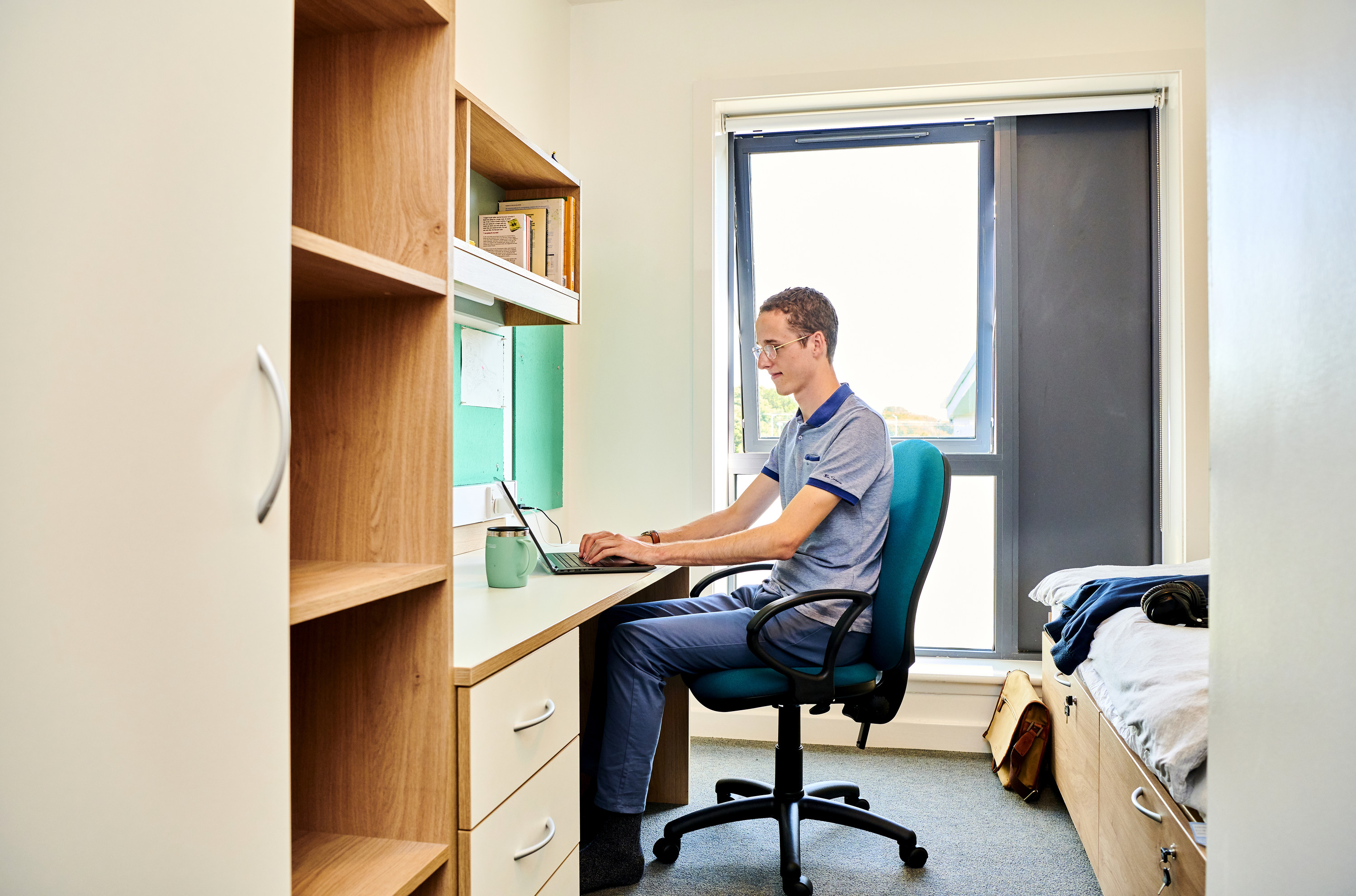 Student in a South College bedroom