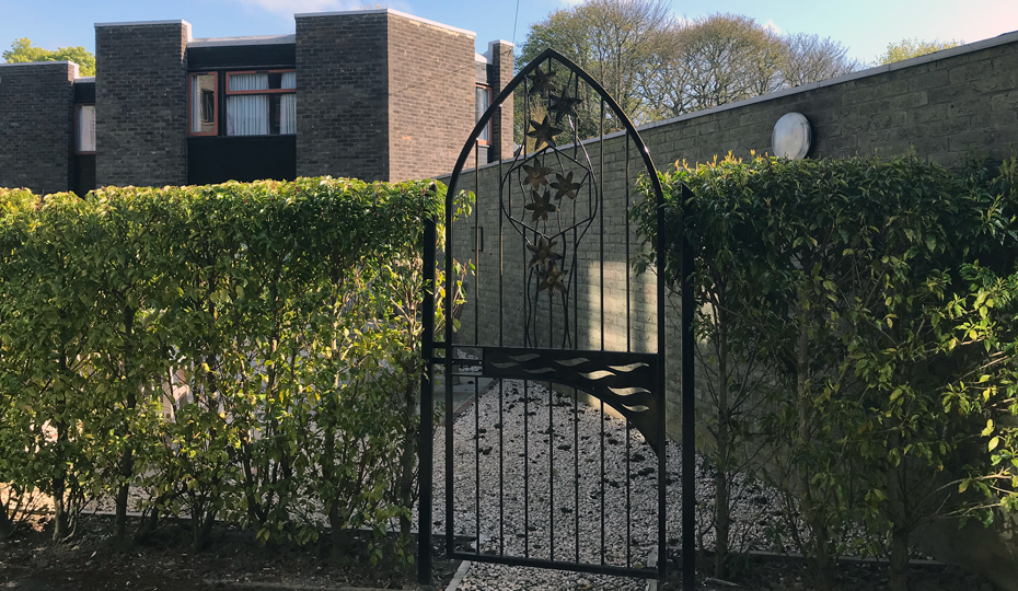 The gated entrance to the Garden of Reflection