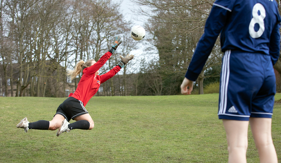 Students playing football on Trevelyan College grounds