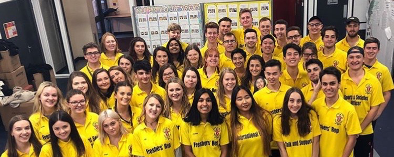 TA group of students all wearing yellow t-shirts