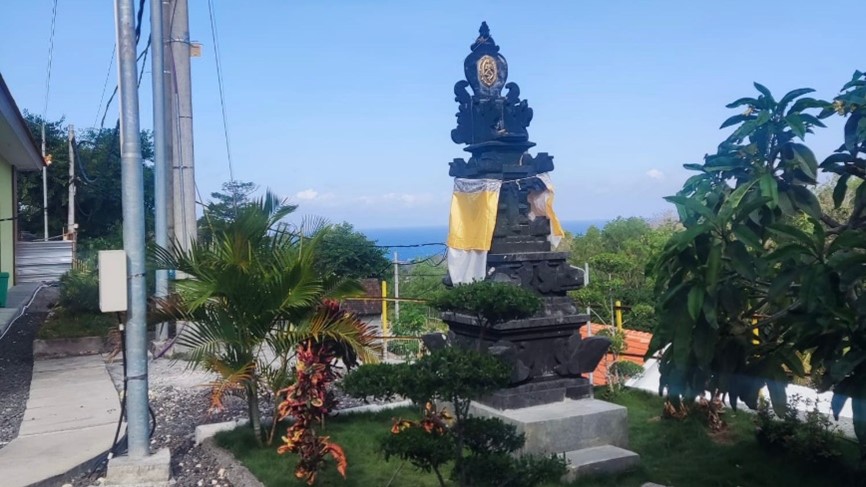 Small temple in area of solar farms as a continuation of melaspas in daily praying