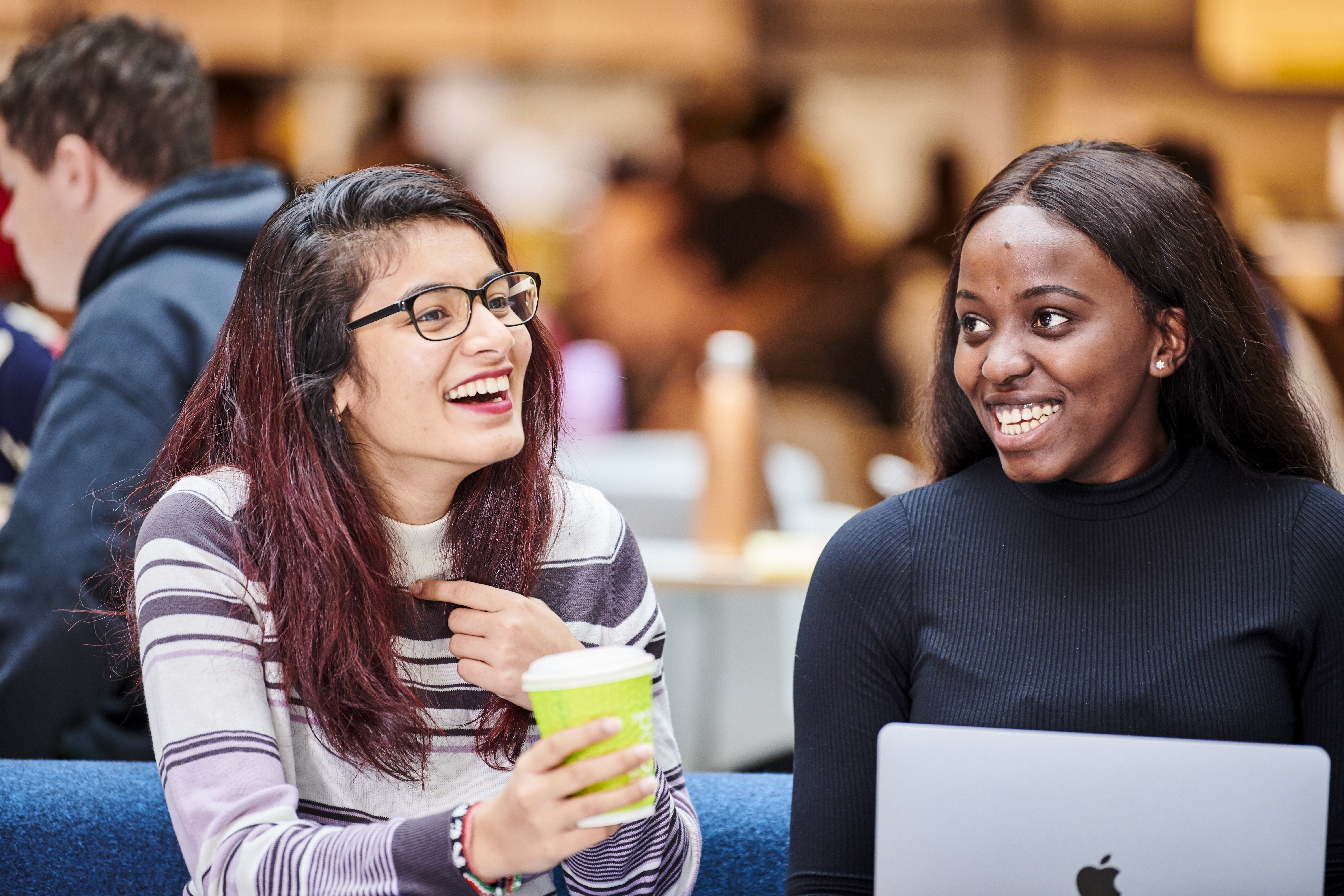 Two female students laughing
