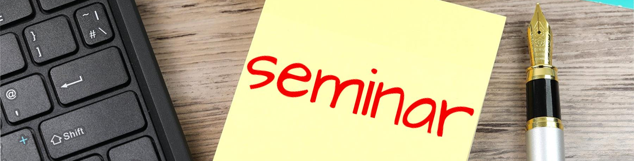 Postit note with the word seminar written in red