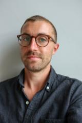 Photo of Mike Crawley against a plain grey background