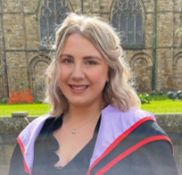 Headshot of a student in graduation robes