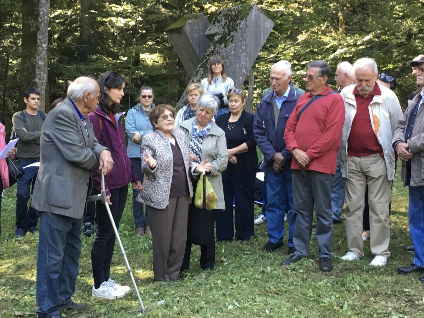 Group listening to a talk outside