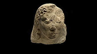 A stone sculpture of a head