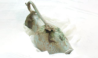 A Roman bronze highly decorative jug