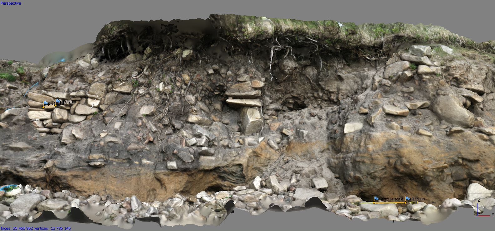 Photograph of a section through the ground with turf on top and soil/stones below