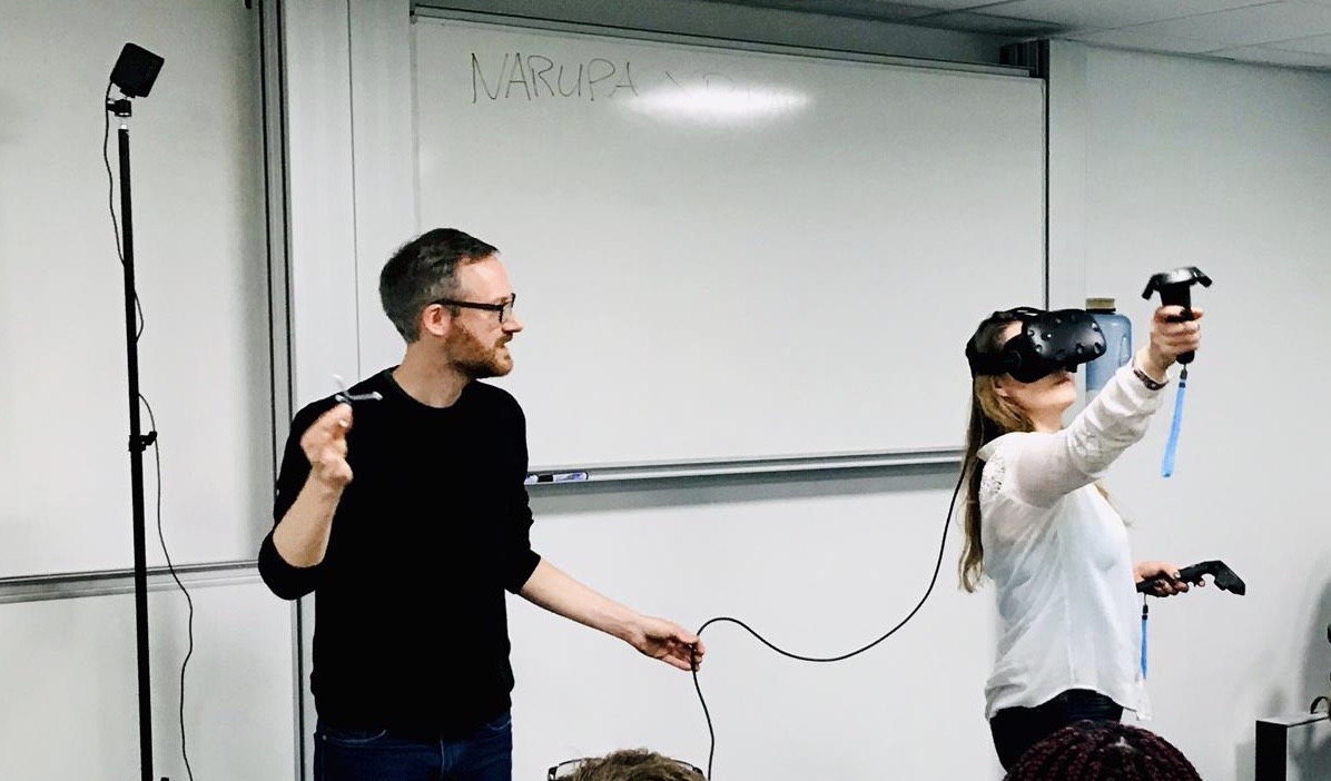 Person taking part in an experiment wearing an electronic headset