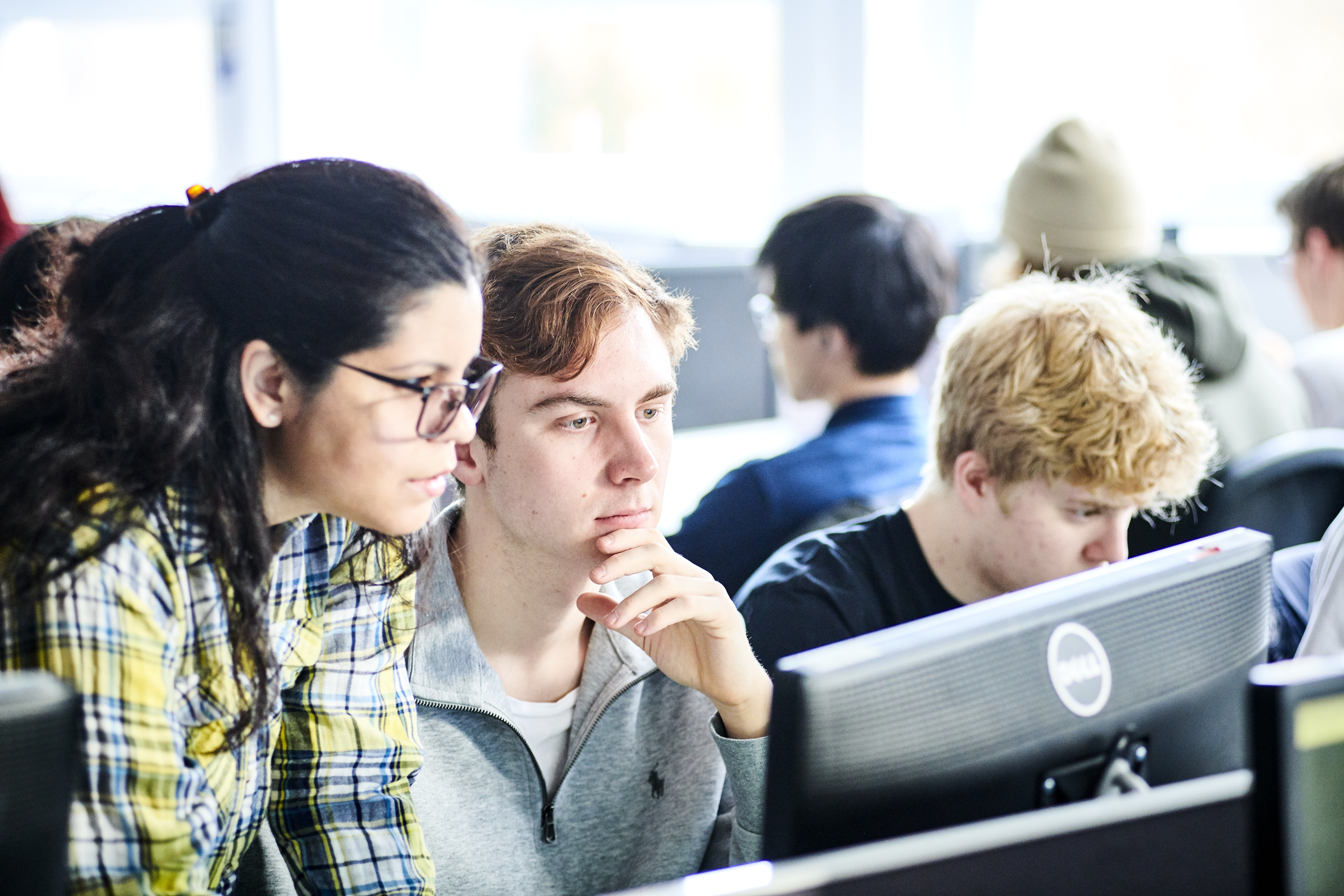 TAcademic and student at a computer