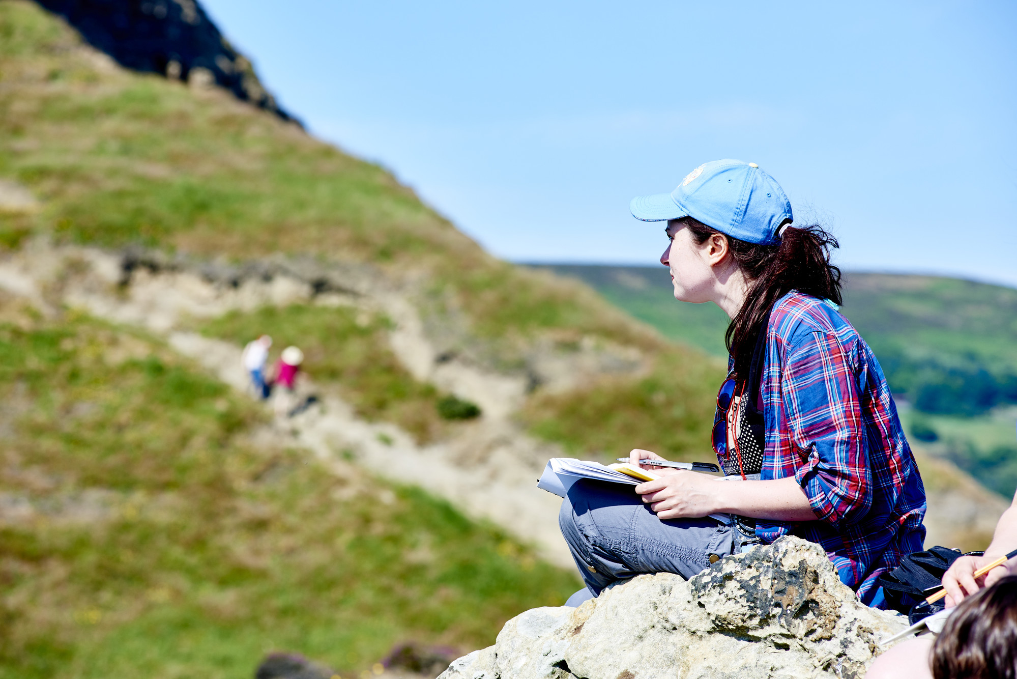 Woman sat on rocks