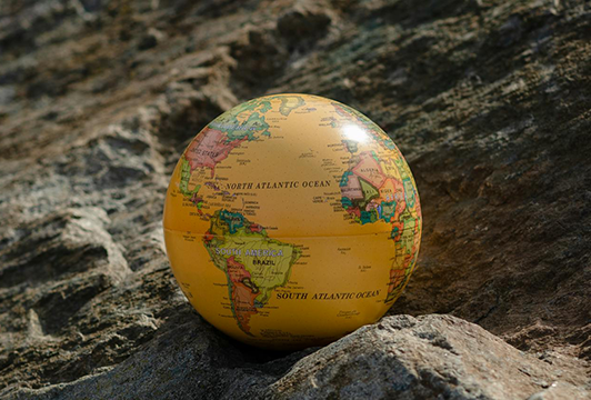 Tiny globe on a rock