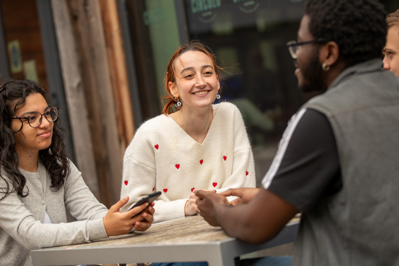 Group of students sat at a table