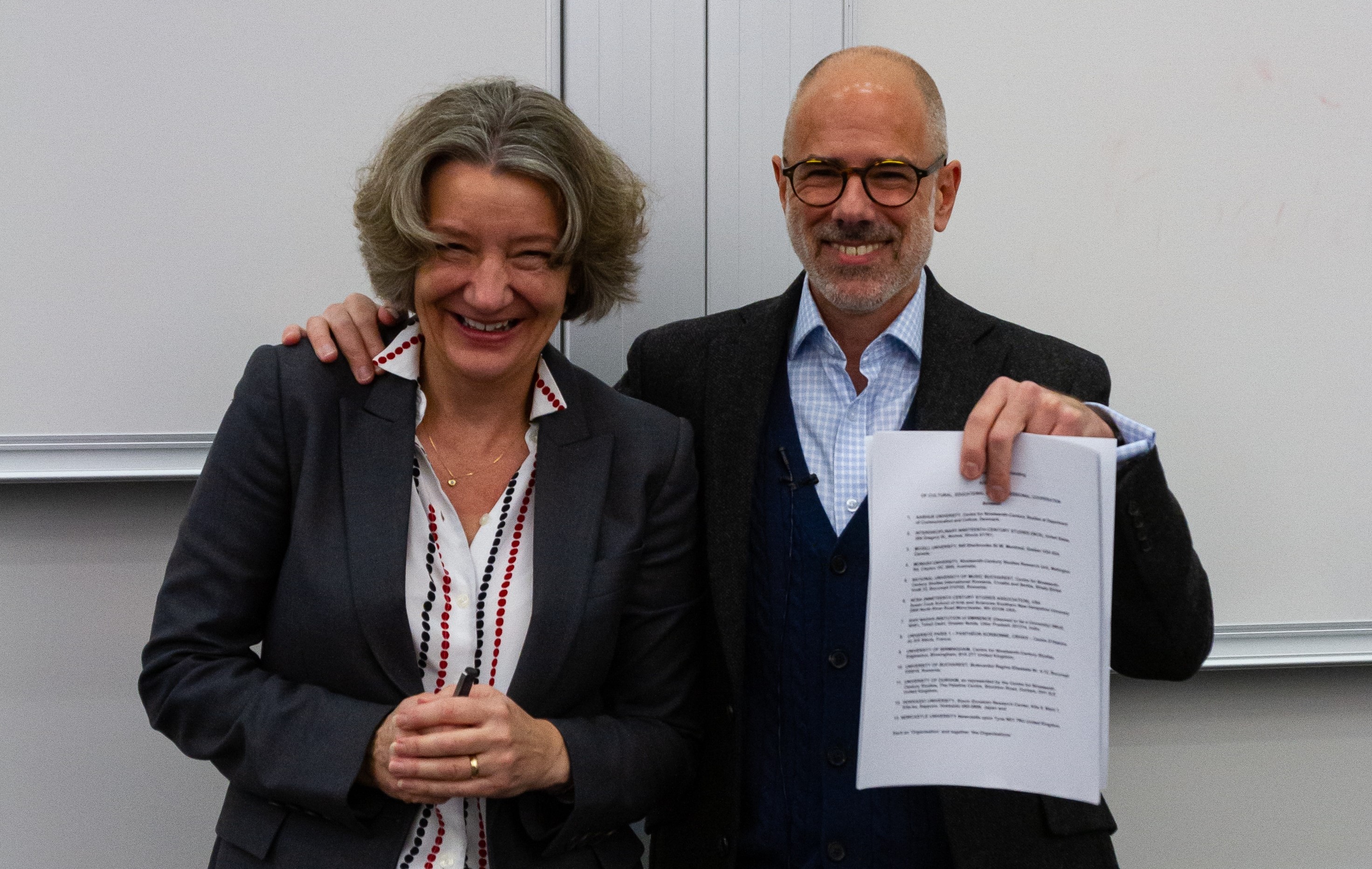 Vice-Chancellor Professor Karen O'Brien and Professor Bennett Zon, Director of CNCS, holding the Memorandum of Understanding