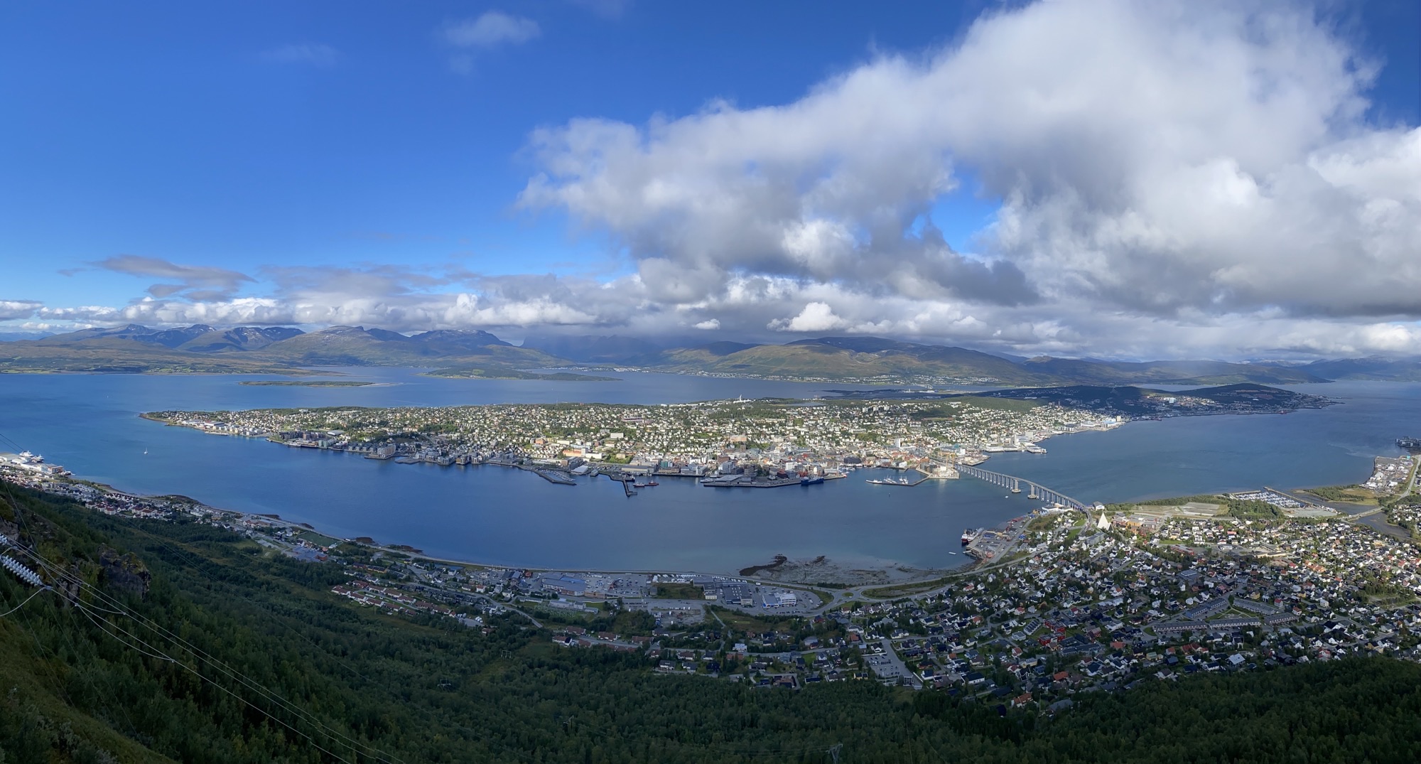 blue sky aerial photo of a coast landscape with houses