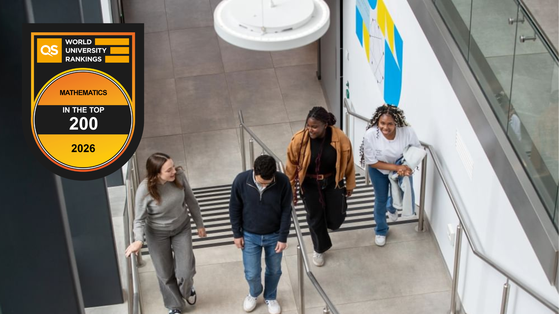 Students walking up the a staircase in the Department of Computer Science and Mathematics