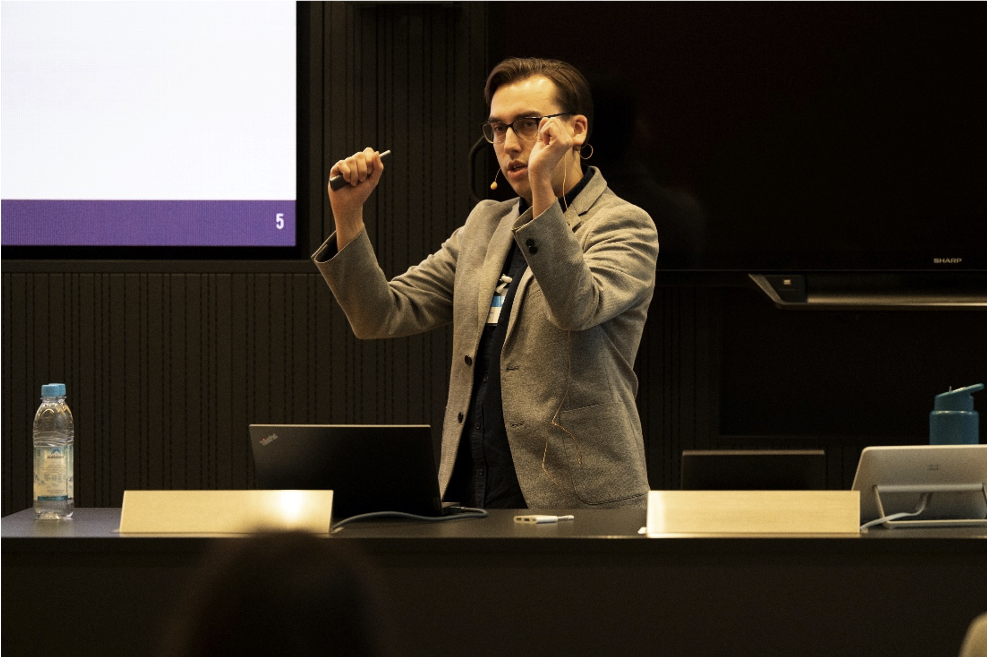 Dan Ruttley holding clenched fists aloft in an 'I won!' pose